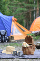 Set of camping equipment outdoors on summer day