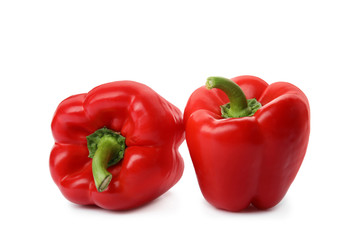 Obraz na płótnie Canvas Raw ripe paprika peppers on white background