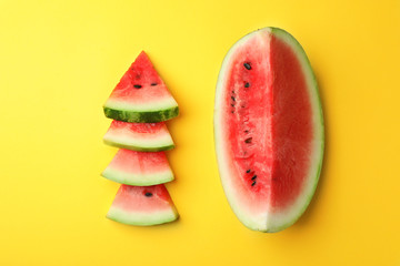 Flat lay composition with slices of watermelon on color background
