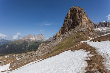 Spring Dolomites panorama of the Sass Becè and Sassopiatto Peaks with the last snows melting, Fassa Valley, Trentino, Italy