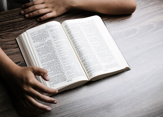 Hands With Open Bible