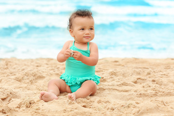 Adorable African-American girl on beach