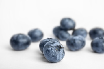 Tasty ripe blueberry on white background, closeup