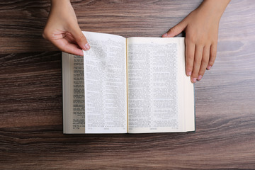 Naklejka premium Hands With Open Bible