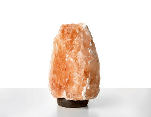Exotic Himalayan salt lamp on white background