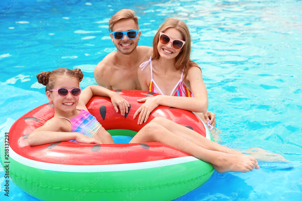 Sticker happy family in pool on sunny day