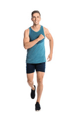 Sporty young man running on white background
