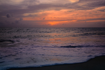Obraz premium View of the sunset at Mai Khao Beach in Phuket, Thailand