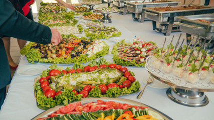 buffet: people take food in plates.