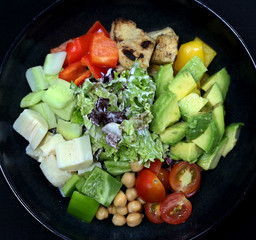 cobb salad in a black plate