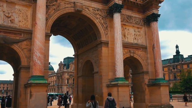 Slowmotion of people walking into the louvre in paris france