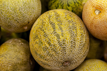 Fresh juicy melon on the counter of the store. View from above.