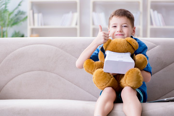 Young little boy with VR virtual reality glasses