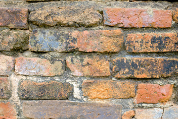 Cracked Dark Orange Old Brick Wall Texture background at thai ancient temple.