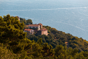 stone house with sea background