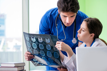 Woman and man doctors radiologists working at the clinic 