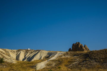 Stone and hill with blue sky in summer