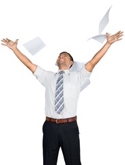 Portrait of a Businessman Throwing Papers