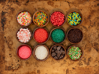 Twelve Bowls of Sprinkles in Wooden Bowls
