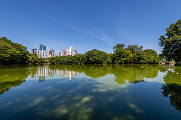 Fototapeta na wymiar Reflections of the Atlanta Skyline in Lake Clara Meer