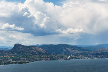 Fototapeta na wymiar Okanagan lake at summer day with clouds on the sky.