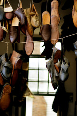 Fototapeta na wymiar Handmade shoes hanging on display