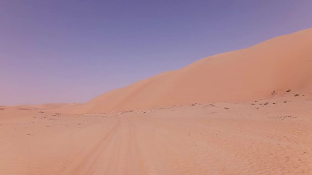 Traveling on an off-road car on the sand of Rub al Khali desert stock footage video