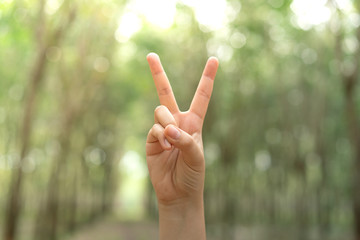 Two fingers with blur background body language sign V sign.
