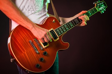 Fototapeta na wymiar Closeup of a Musician Playing an Electric Guitar