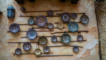 Vintage porcelain plates hanging in the walls as display.