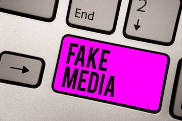 Text sign showing Fake Media. Conceptual photo An formation held by brodcasters which we cannot rely on Keyboard purple key Intention create computer computing reflection document.