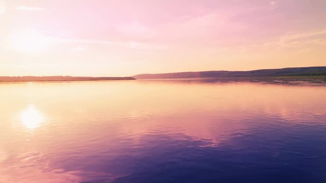 Aerial View: Colorful Sunset. Flying Over The River.
