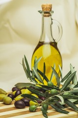 Bottle of Olive Oil with Green and Black Olives