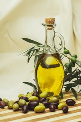 Bottle of Olive Oil with Green and Black Olives