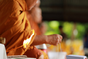 Candle light in Buddhist prayer process.