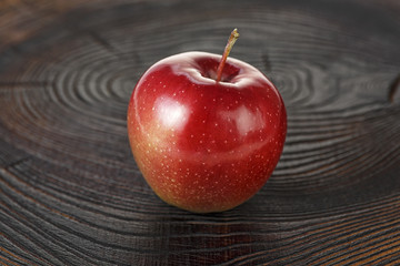 Red apple on wooden background