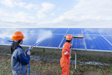 Engineers are checking the solar panel for maintenance. And clean the solar panel is always...