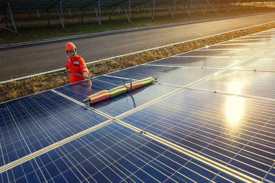 Engineers are checking the solar panel for maintenance. And clean the solar panel is always available.