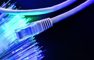 The local wire lies on a black ribbed surface with blue-green illumination. The view from the top.