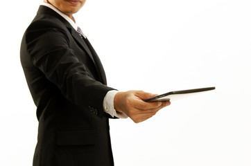 Business man hand holding tablet and giving to in front of Isolated on white backgrounds
