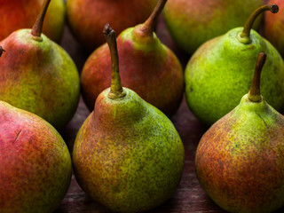  Fresh ripe organic yellow pears on wooden background. Vegetarian, vegan, healthy diet food. Fruit background. Pears harvest. 