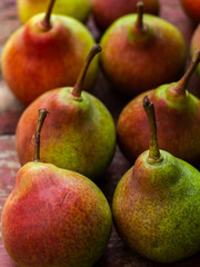  Fresh ripe organic yellow pears on wooden background. Vegetarian, vegan, healthy diet food. Fruit background. Pears harvest. 