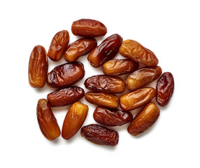 Heap of dried dates isolated on white background. Top view.