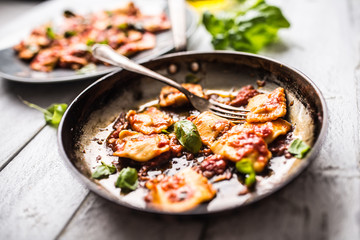 Italian or mediterranean food pasta ravioli of tomato sauce.