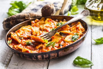 Italian or mediterranean food pasta ravioli of tomato sauce.
