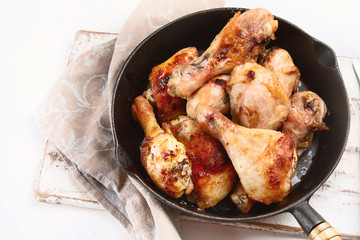 Fried chicken legs in pan