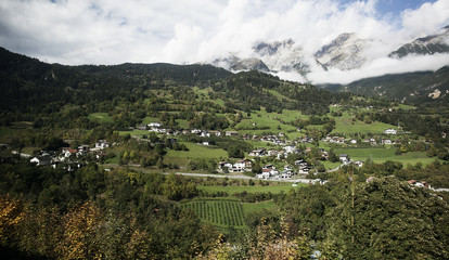 View of beautiful village in the middle of mountain from train in Austria
