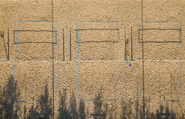 Aerial view of beach volley ball field in morning light during sunrise