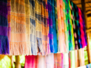 group of beautiful pattern texture Thai traditional woven fabric silk handcraft style textiles detail  fabric fashionable texture most valuable, handmade for sold in the local market of Thailand.