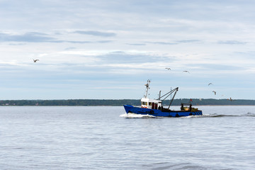 Fishing boat in gulf of Riga, Baltic sea.